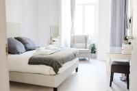 Łóżko lub łóżka w pokoju w obiekcie White Fanti Apartment