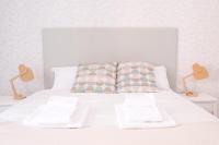 Łóżko lub łóżka w pokoju w obiekcie White Fanti Apartment
