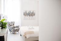 Łóżko lub łóżka w pokoju w obiekcie White Fanti Apartment