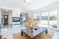 Televízia a/alebo spoločenská miestnosť v ubytovaní Apartment DARIO