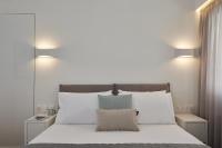 A bed or beds in a room at Marvelous n Bright Apt next to Megaro Mousikis
