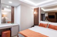 Postel nebo postele na pokoji v ubytování Sherry Suites Karaköy