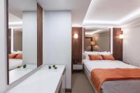 Postel nebo postele na pokoji v ubytování Sherry Suites Karaköy