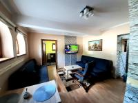 Televízia a/alebo spoločenská miestnosť v ubytovaní APARTAMENT ELIZABETH
