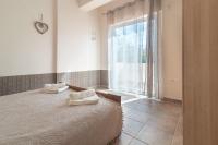 Posteľ alebo postele v izbe v ubytovaní Naiada Stomio-A apartment