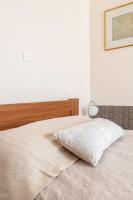 Posteľ alebo postele v izbe v ubytovaní Naiada Stomio-A apartment