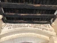 ancient writing on the ceiling of a building at Bâtisse du pont pinard et son granit rose in Semur-en-Auxois