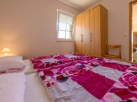Posteľ alebo postele v izbe v ubytovaní Apartments ROKO
