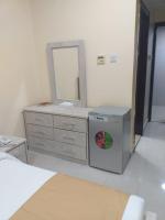 Postel nebo postele na pokoji v ubytování Al Khaleej Plaza Furnished Apartments LLC