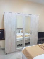Postel nebo postele na pokoji v ubytování Al Khaleej Plaza Furnished Apartments LLC