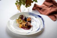 a white plate with food on a table at Tickton Grange Hotel in Beverley
