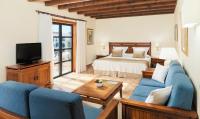 A bed or beds in a room at Princesa Yaiza Suite Hotel Resort