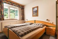 Łóżko lub łóżka w pokoju w obiekcie Ferienwohnung Salzburg