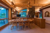 a kitchen and dining room with a table and chairs at Chalet Waldhaus Rappakopf in Schruns