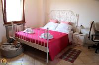 A bed or beds in a room at La Luna nel Parco