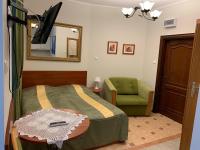 Televízia a/alebo spoločenská miestnosť v ubytovaní Apartamenty Superior w Rewalu