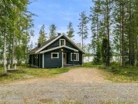 a black house in the middle of a dirt road at Holiday Home Tiira by Interhome in Himahuuha