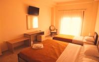 Postel nebo postele na pokoji v ubytování Hotel Victoria