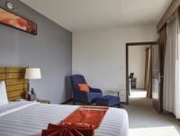 Postel nebo postele na pokoji v ubytování Maple Hotel