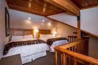 a bedroom with two beds in a room at Kandahar Lodge at Whitefish Mountain Resort in Whitefish