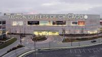 a building with a sign that reads fashion outlets of chicago at Crowne Plaza Chicago O'Hare Hotel & Conference Center by IHG in Rosemont