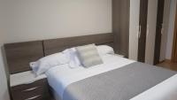 Posteľ alebo postele v izbe v ubytovaní Apartamentos Palacio Azcárate Calle Calvario