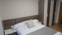 Posteľ alebo postele v izbe v ubytovaní Apartamentos Palacio Azcárate Calle Calvario