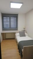 Posteľ alebo postele v izbe v ubytovaní Apartamentos Palacio Azcárate Calle Calvario