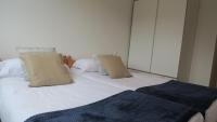 Posteľ alebo postele v izbe v ubytovaní Apartamentos Palacio Azcárate Calle Calvario