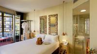 a bedroom with a large white bed and a mirror at Axel Hotel Barcelona - Adults Only in Barcelona