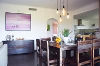 a kitchen with a table with chairs and a dining room at Villa Angel in La Gaude