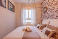 Łóżko lub łóżka w pokoju w obiekcie Apartamento Gran Via Center