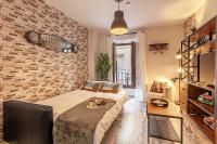 Łóżko lub łóżka w pokoju w obiekcie Apartamento Gran Via Center