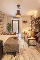 Łóżko lub łóżka w pokoju w obiekcie Apartamento Gran Via Center