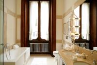 a bathroom with a tub and a sink and a bath tub at Villa Spalletti Trivelli - Small Luxury Hotels of the World in Rome