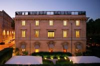 a large brick building with lights on at Villa Spalletti Trivelli - Small Luxury Hotels of the World in Rome
