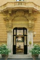 an entrance to a building with two potted plants at Villa Spalletti Trivelli - Small Luxury Hotels of the World in Rome
