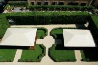 an overhead view of a garden with two white tables at Villa Spalletti Trivelli - Small Luxury Hotels of the World in Rome