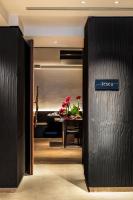 a sign that says totti on a wall in a room at The Prince Akatoki London in London