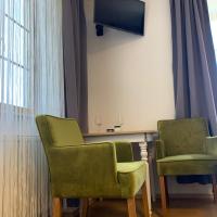 Televízia a/alebo spoločenská miestnosť v ubytovaní Enns Sleep Gasthaus Backhendlstation