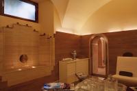 a bathroom with a tub and a glass table at Villa Spalletti Trivelli - Small Luxury Hotels of the World in Rome