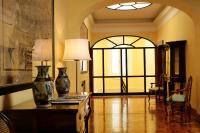 a living room with a table with a vase on it at Villa Spalletti Trivelli - Small Luxury Hotels of the World in Rome