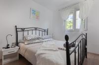Posteľ alebo postele v izbe v ubytovaní Sea view Ela Apartments