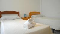 Postel nebo postele na pokoji v ubytování ConilPlus Apartment BODEGA
