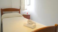 Postel nebo postele na pokoji v ubytování ConilPlus Apartment BODEGA