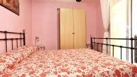 Posteľ alebo postele v izbe v ubytovaní B&B Ersilia