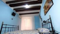 Posteľ alebo postele v izbe v ubytovaní B&B Ersilia