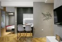 Televízia a/alebo spoločenská miestnosť v ubytovaní Olvios Luxury Suites