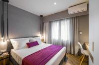 Posteľ alebo postele v izbe v ubytovaní Olvios Luxury Suites