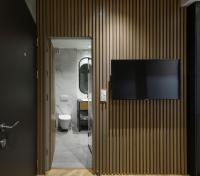 Televízia a/alebo spoločenská miestnosť v ubytovaní Olvios Luxury Suites